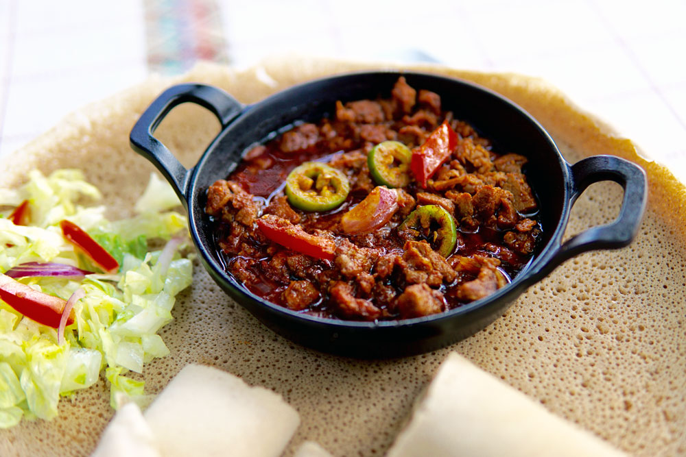 Sizzling Beef Tibs served with injera at Habesha Cafe.