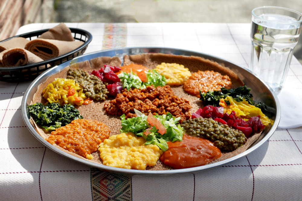 A generous platter of the Beyond Full Habesha Vegan Combo at Habesha Cafe.