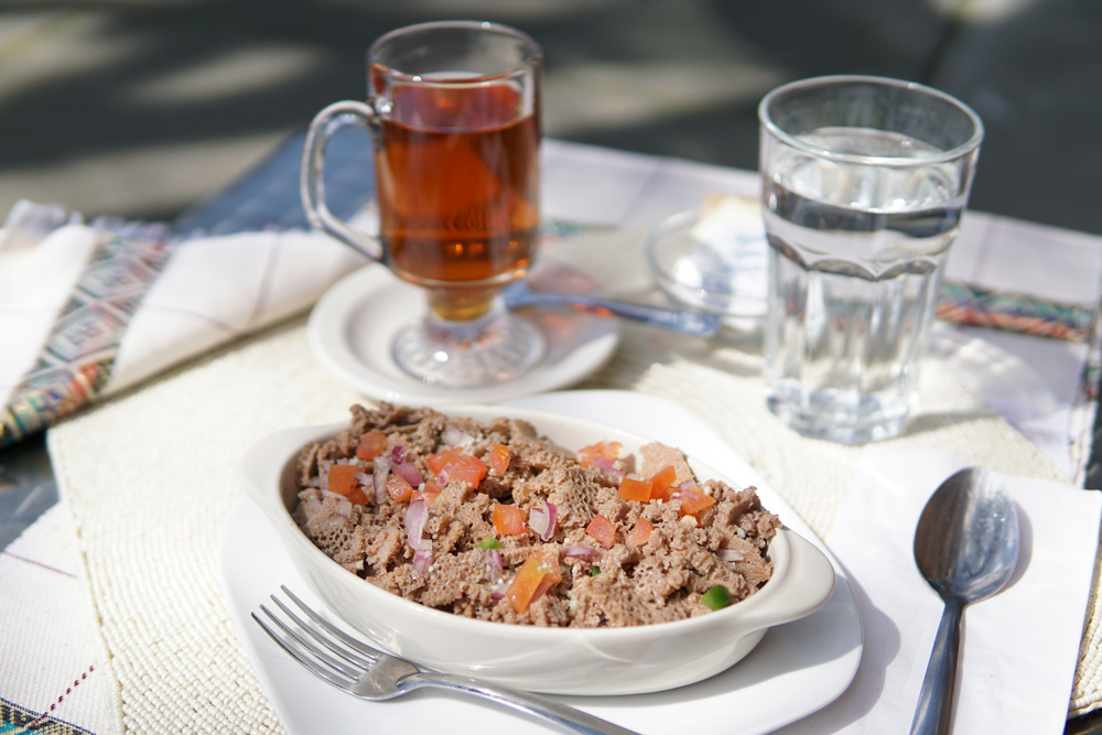 A savory plate of Tomato Fit Fit at Habesha Cafe.